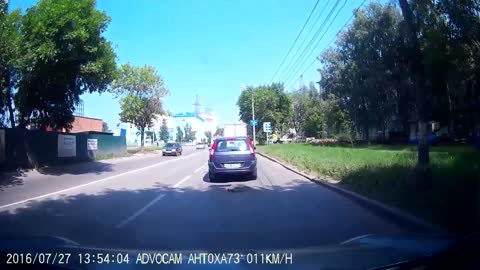 Sudden stop of blue Ford Focus at the intersection