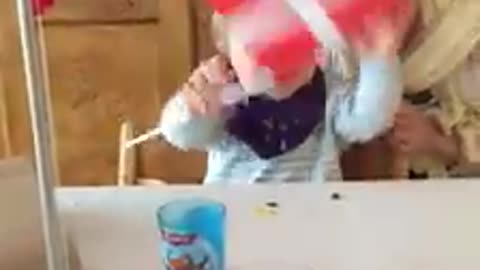 funny baby plays with flag