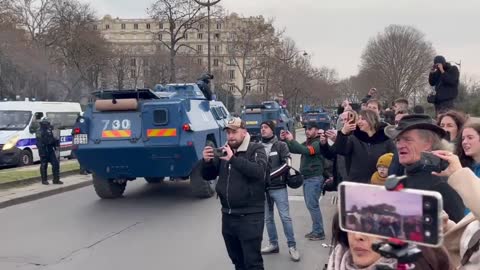 Chants of "freedom" by anti Coronavirus tyranny protesters at the Eiffel tower as Macron's minions roll by in their armoured vehicles for the second day in a row.