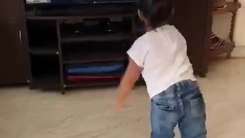 Toddler Smashes T.V while dancing. Very funny!!!