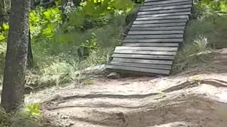 Mountain bike hill ramp fail falls off into grass hits branch
