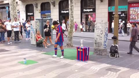 Messi showing football trick on street