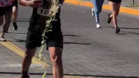 Runner Gets Superhero Escort to Finish Line