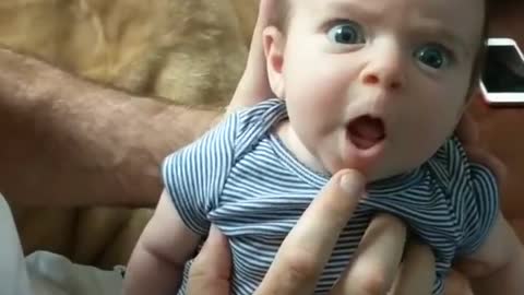 Adorable talking baby wants mommy to listen to her.