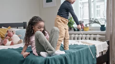 Children's Enjoying the Home Quarantine with Cute White Cat