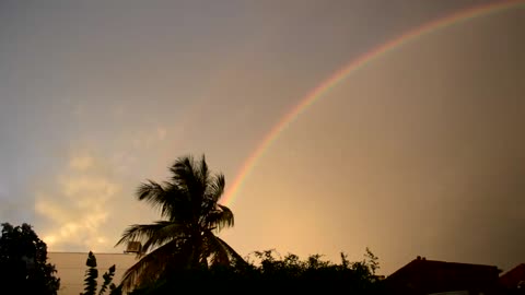 Rainbow over house