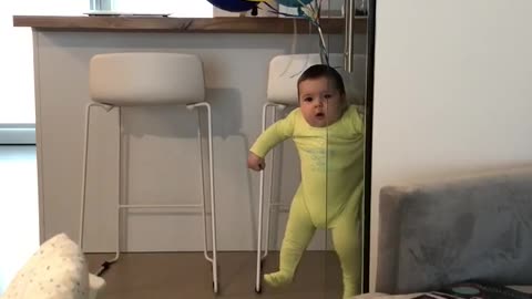 Baby "floats" when tied to many balloons