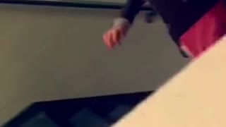 Student trips while running up the stairs at school