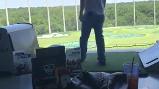 Man lets go of golf club it hits the ceiling