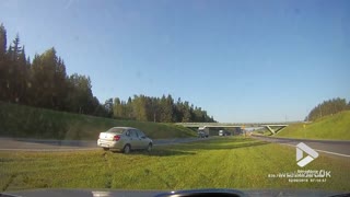 Car skids and spins off road