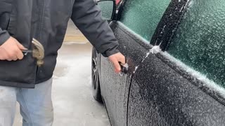 Using a Hammer to Open a Frozen Car Door