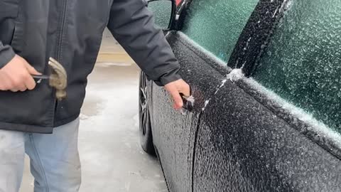 Using a Hammer to Open a Frozen Car Door