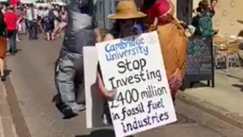 Dinosaurs protest on the streets of Cambridge