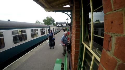 People Walking and Waiting on Train Platform