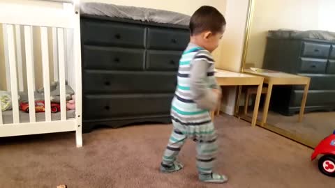 Watch when this toddler gets his toy phone to play his jam