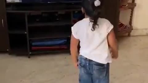 Girl smashes TV while dancing