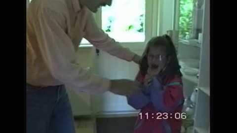 Little girl making hilarious and heartbreaking faces after father pulls her fore tooth out