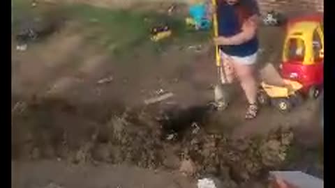 Playful Puppy Helps With Yard Work