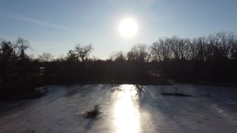 Neighborhood Pond at Sunset from Drone