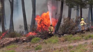 Rain helps control large wildfire in Spain