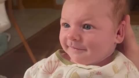 Baby sweetly smiles at dad in heartwarming clip