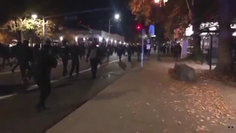 Vancouver Washington. Antifa walking and smashing storefronts.