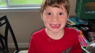 Kid pushes his tooth out with tongue