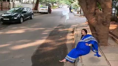 Pregnant Woman crying in footpath with pain