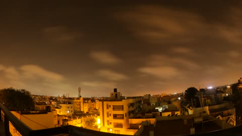 Hyper Time Lapse Video Of Moving Clouds Above and Across The City.