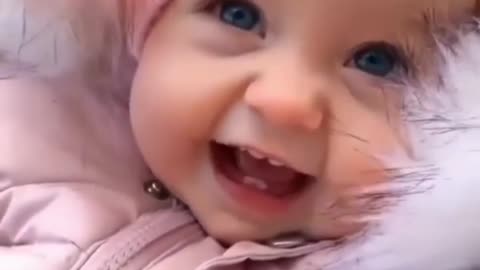 A beautiful baby girl laughing when she saw her mother