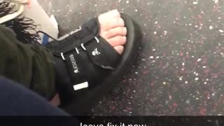Man wears skull sandals on subway train