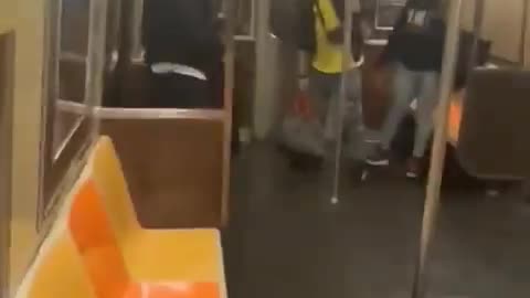 a man being shot in the head with his own gun on the NYC Brooklyn subway.