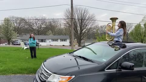 Girl Plays Trumpet From Car Wishing Happy Birthday to Quarantined Friend