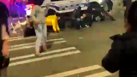 Surrounded by a mob, Tacoma police SUV barrels through crowd, runs over at least one