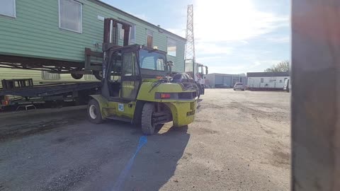 Static caravan being loaded with a forklift, carlisle