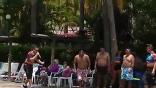 Guy at resort belly flops into pool