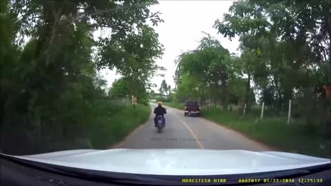 Motorcyclist Catches Snake Crossing Road