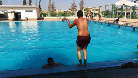 Funny Boy Jump In Hilarious Way In Pool