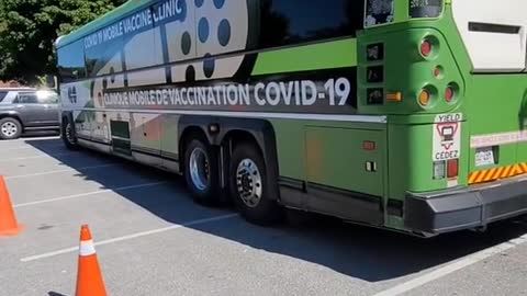 MOBILE 'CLOT SHOT' CLINIC IN BARRIE ONT. CANADA - LOOK AT THAT LONG LINE UP! - THEY GETTING REAL DESPERATE!