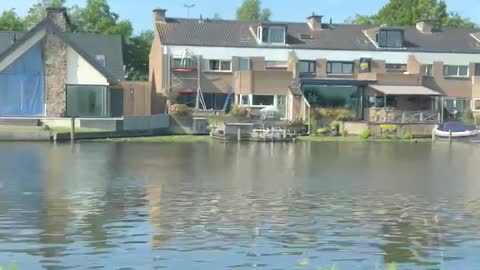 Peaceful drive along a canal in Holland