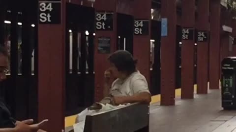 Woman flicks booger on man in NYC subway