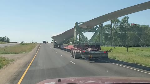 Huge Wind tower blade down highway