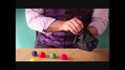 Only The Magician Can Select The Right Coloured Ball.