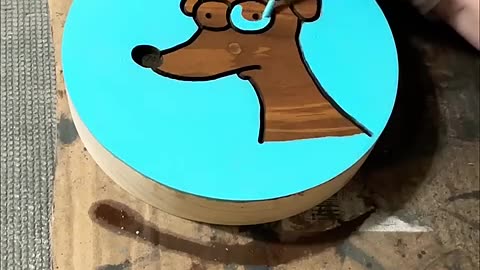 A dog painting on a wood