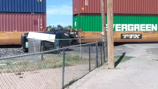 Train Takes out Car Carrier
