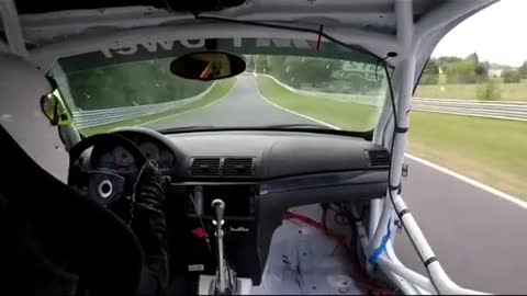The first view of racing driver driving the car shows the car repaired.