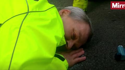 Insulate Britain protester glues his face to the road to stop himself from being removed