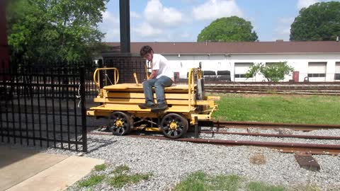 Fairmont ST2 Speeder Spitting And Sputtering Along A Couple Inches Of Track At The Newton Depot