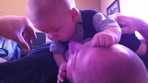"Killer" baby attacks dad's face