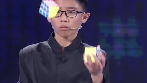 Fastest Time To Solve Three Rubik's Cubes Whilst Juggling - Guinness World Records